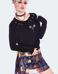 Cardigan con rune, teschi e scarabeo