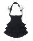 Corsetto vestito corto con catene,croci e volant. Attaccatura a fibbia al collo.